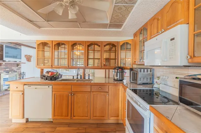 a kitchen with stainless steel appliances granite countertop a stove and a sink