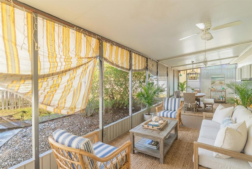 4202 Tangier Street Sebring, FL 33872 - Photo 19 of 29 a living room with furniture and a floor to ceiling window