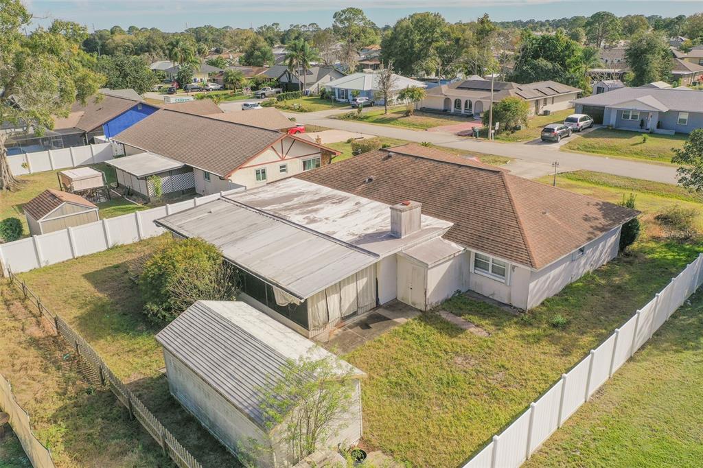 4202 Tangier Street Sebring, FL 33872 - Photo 21 of 29 a view of a house with pool and yard