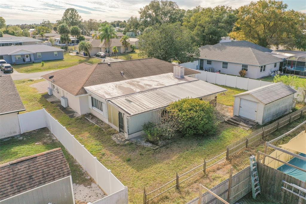 4202 Tangier Street Sebring, FL 33872 - Photo 22 of 29 a view of a house with pool and chairs