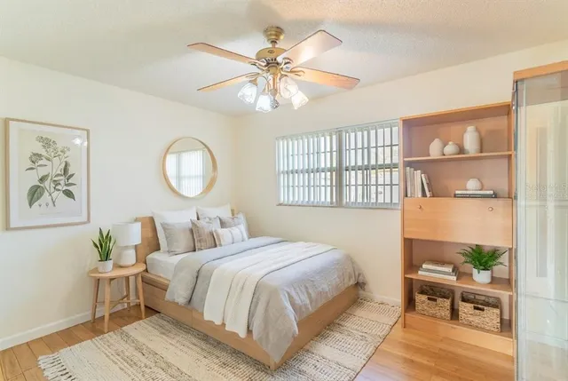 a bedroom with a large bed and a window