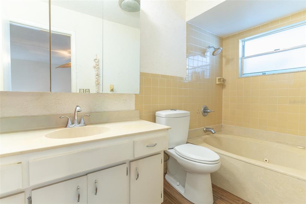 4202 Tangier Street Sebring, FL 33872 - Photo 6 of 29 a bathroom with a sink a toilet and shower