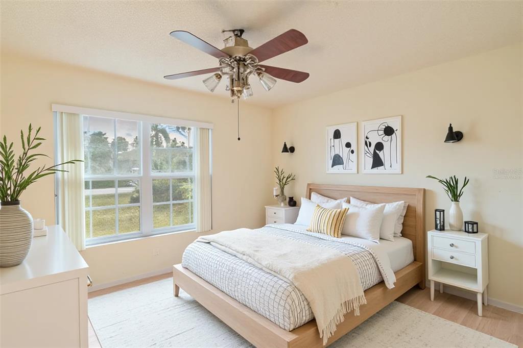 4202 Tangier Street Sebring, FL 33872 - Photo 7 of 29 a bedroom with a large bed and a window