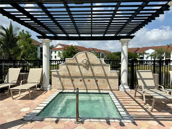 a view of swimming pool with a patio
