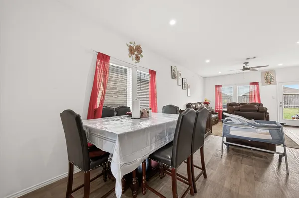 a view of a dining room with furniture window and wooden floor