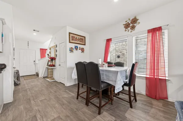 a kitchen with granite countertop stainless steel appliances a sink a stove and cabinets