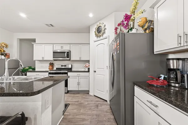a view of a kitchen and utility room