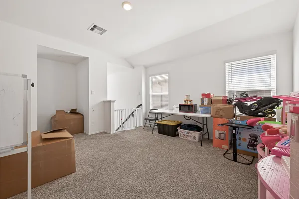a bed room with a bed and a chandelier