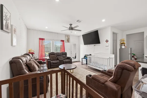 a view of a dining room with furniture and window