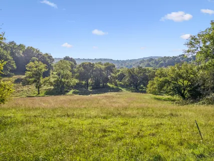 a view of outdoor space with deck and yard