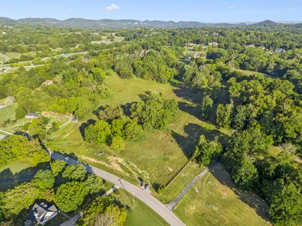 an aerial view of a residential houses with outdoor space