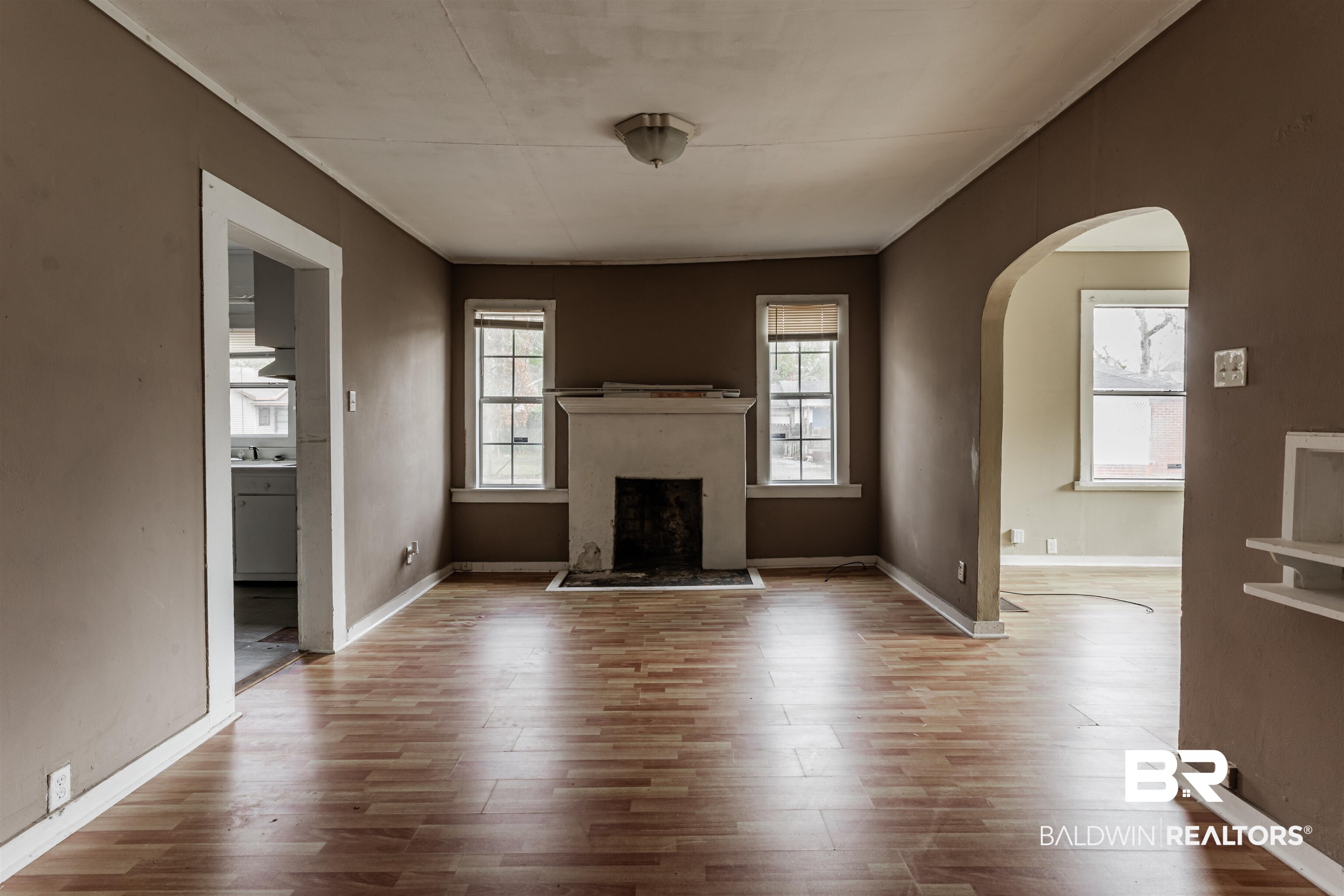 600 Mohawk Street Mobile, AL 36606 - Photo 9 of 20 Unfurnished living room featuring crown molding and light wood-type flooring