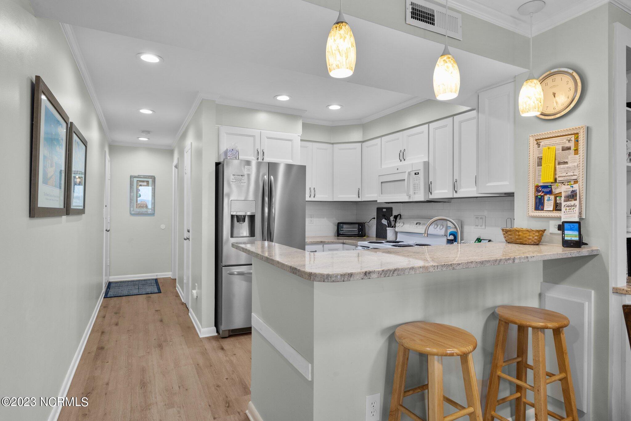 2111 West Fort Macon Road, Unit 215 Atlantic Beach, NC 28512 - Photo 6 of 34 Kitchen/Breakfast Bar