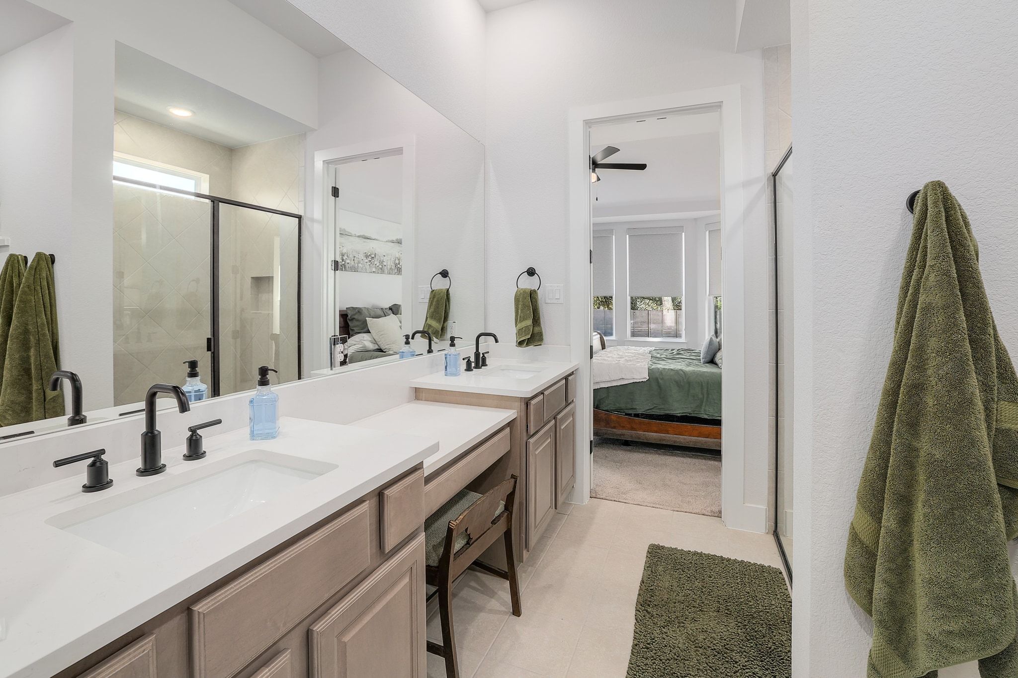 1304 Highcrest Georgetown, TX 78628 - Photo 17 of 32 a en suite bathroom with a double vanity sink and a mirror