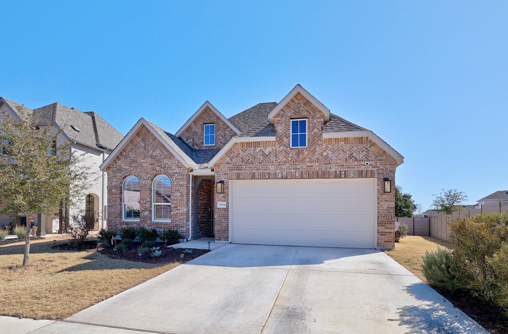 1304 Highcrest Georgetown, TX 78628 - Photo 2 of 32 a front view of a house with a yard