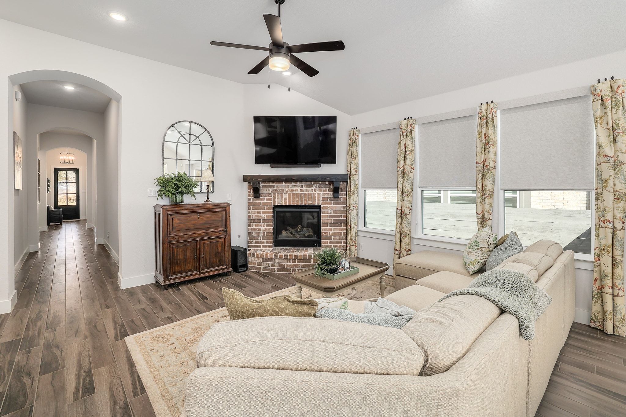 1304 Highcrest Georgetown, TX 78628 - Photo 5 of 32 a living room with furniture a fireplace and a flat screen tv