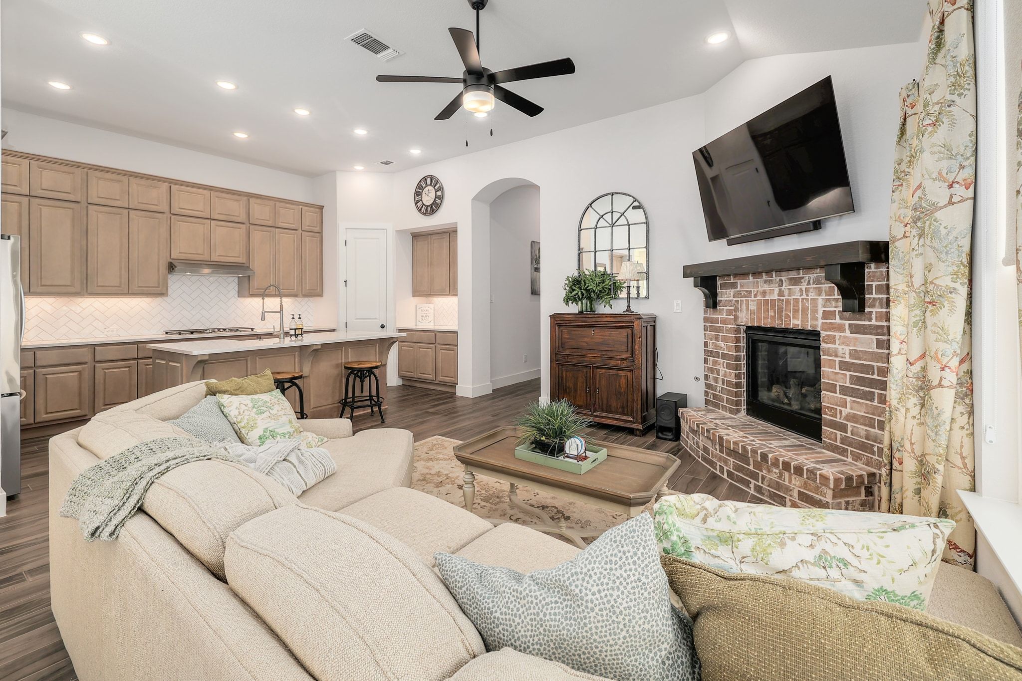 1304 Highcrest Georgetown, TX 78628 - Photo 6 of 32 a living room with furniture a fireplace and a flat screen tv