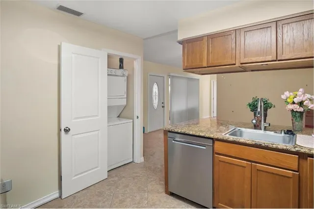 a view of a small space with wooden floor and a chandelier fan