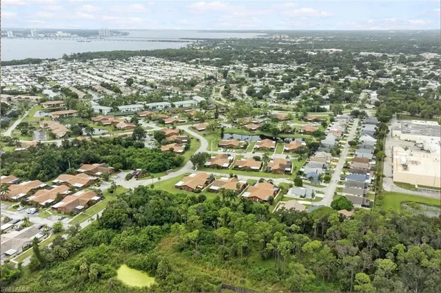 a view of a backyard with sitting area