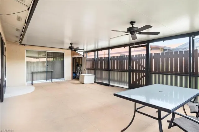 a view of a livingroom with a dining table and chairs