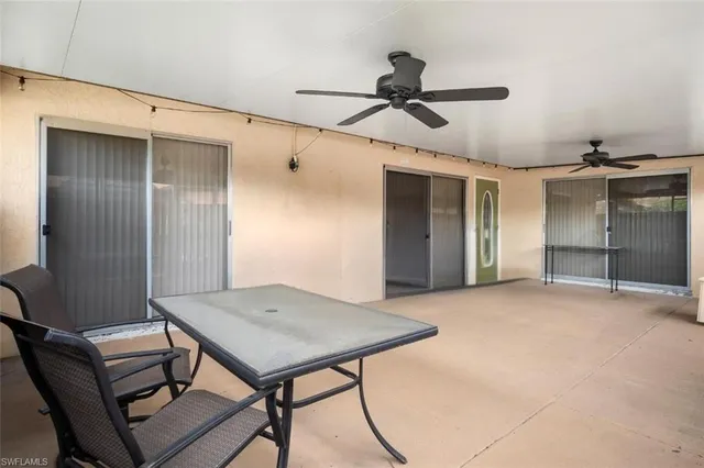 a view of a livingroom with a ceiling fan and entryway
