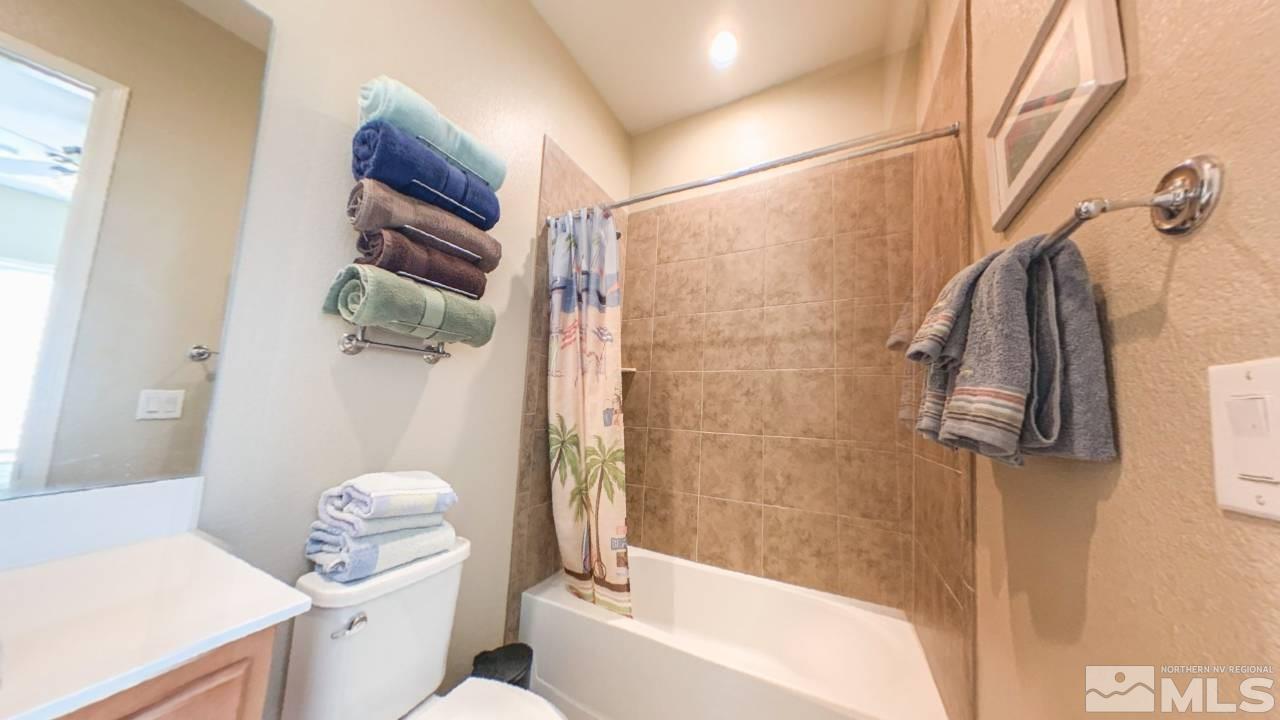 9547 Tencendur Lane Reno, NV 89521 - Photo 15 of 39 a bathroom with a sink toilet and shower
