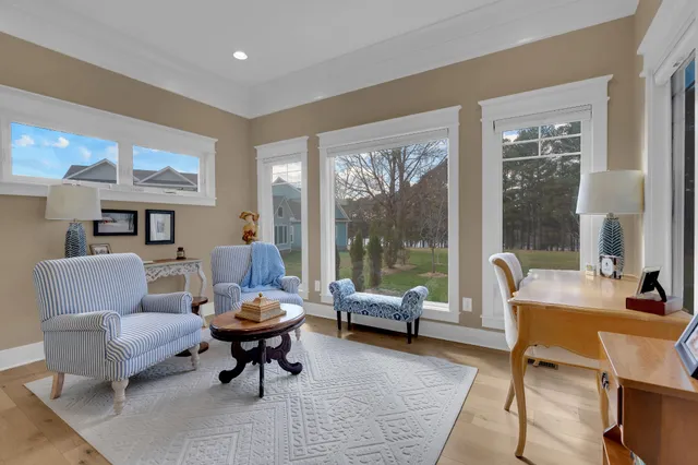 a living room with furniture fireplace and flat screen tv
