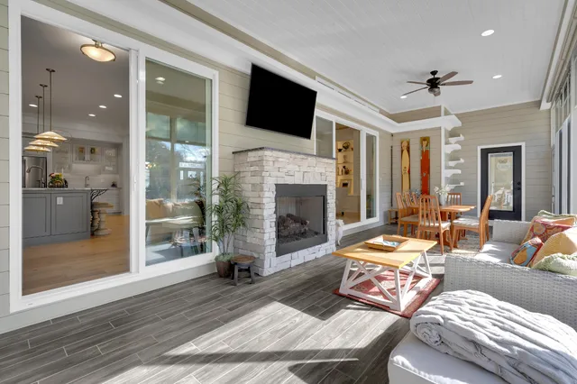 a kitchen with stainless steel appliances granite countertop a table chairs stove refrigerator and cabinets