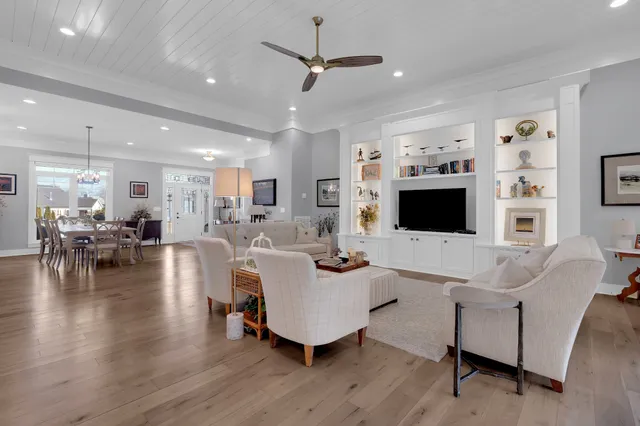 a view of a dining room with furniture and wooden floor
