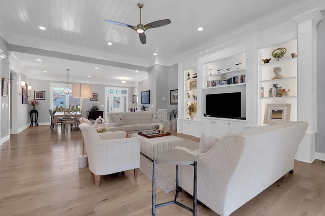 a kitchen with stainless steel appliances kitchen island granite countertop a stove a sink and a granite counter tops with white cabinets