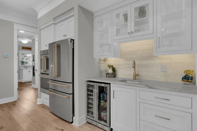 a bathroom with a sink and a mirror with toilet