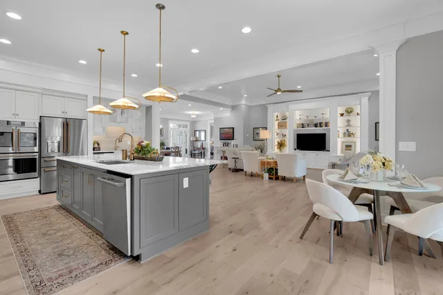 a front view of a house with a garden and yard