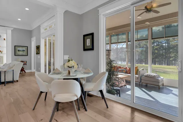 an aerial view of a house with garden space and lake view