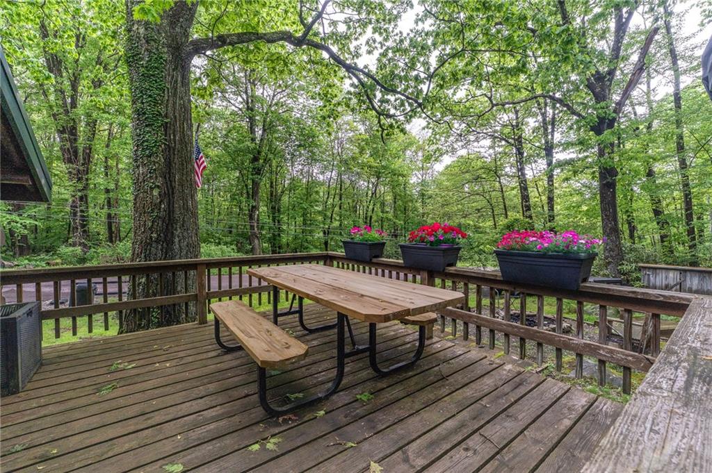 124 New Beaver Creek Road Markleysburg, PA 15459 - Photo 9 of 31 a view of balcony with furniture and wooden deck