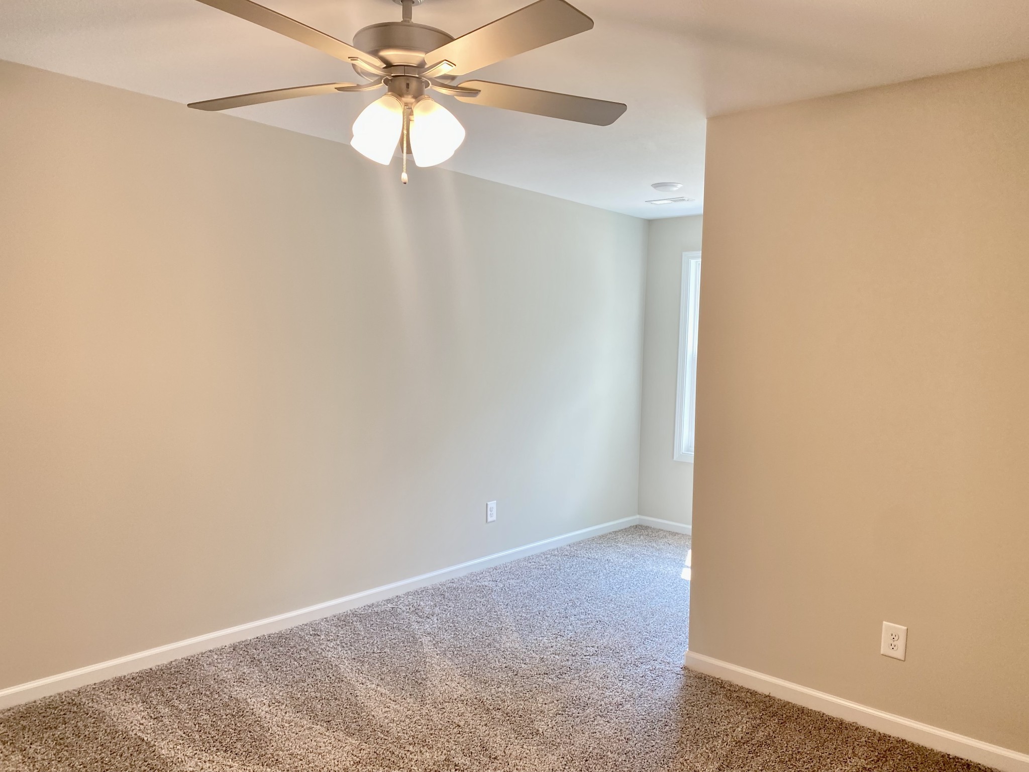 943 Center Road, Unit A Clarksville, TN 37042 - Photo 16 of 23 an empty room with a fan and a fan