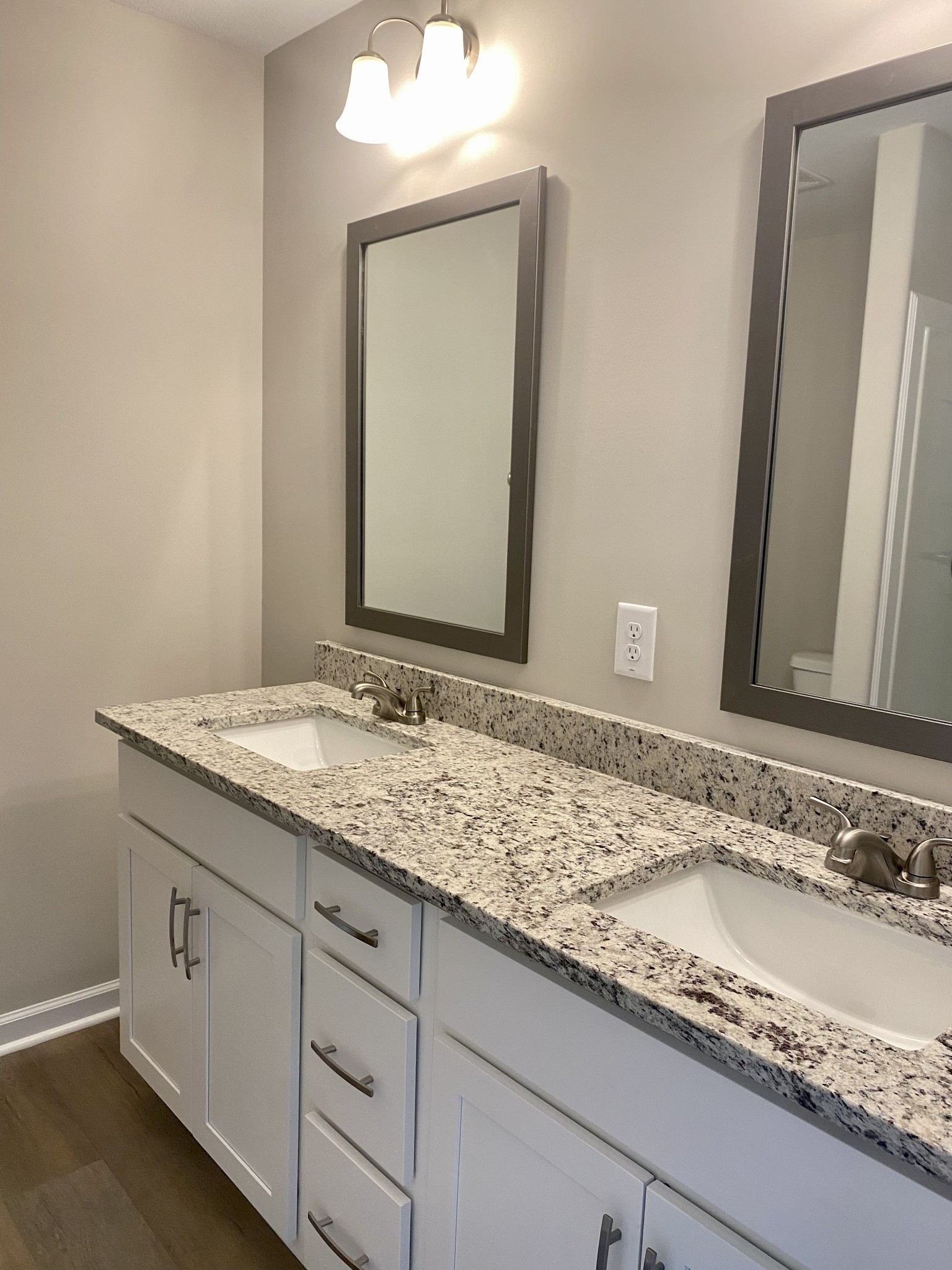 943 Center Road, Unit A Clarksville, TN 37042 - Photo 18 of 23 a bathroom with a granite countertop sink and a mirror