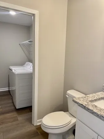 a bathroom with a toilet and a sink