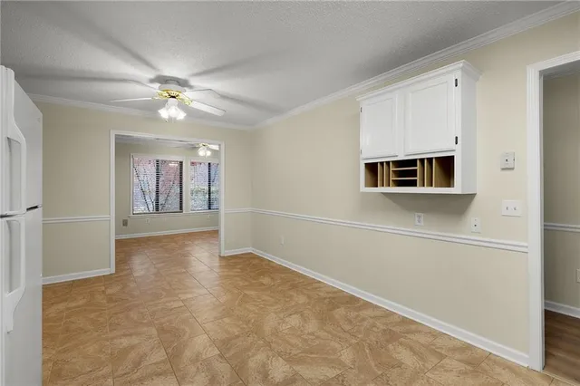 a view of a kitchen with electric appliances