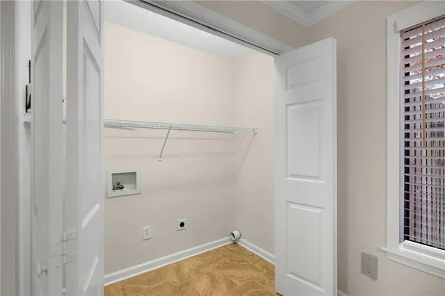 a view of a sign board with buildings in the background