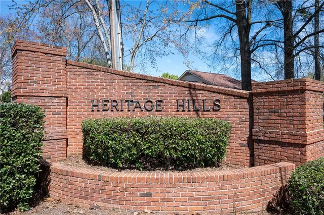 a couple of cars parked next to a yard