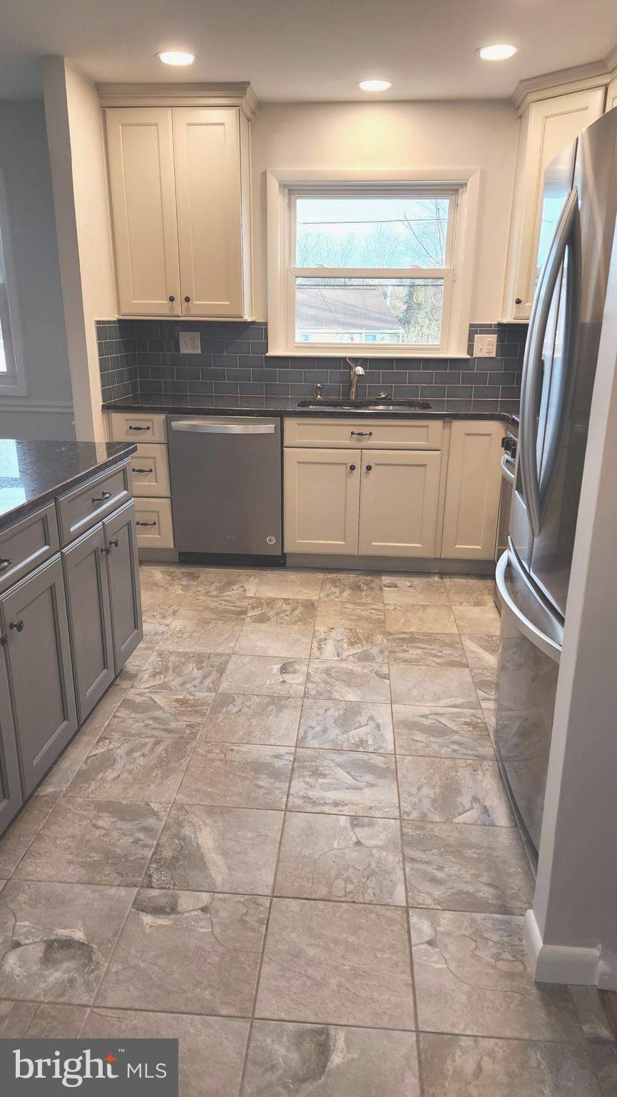 213 Upper Valley Road North Wales, PA 19454 - Photo 11 of 28 a large kitchen with cabinets and a window