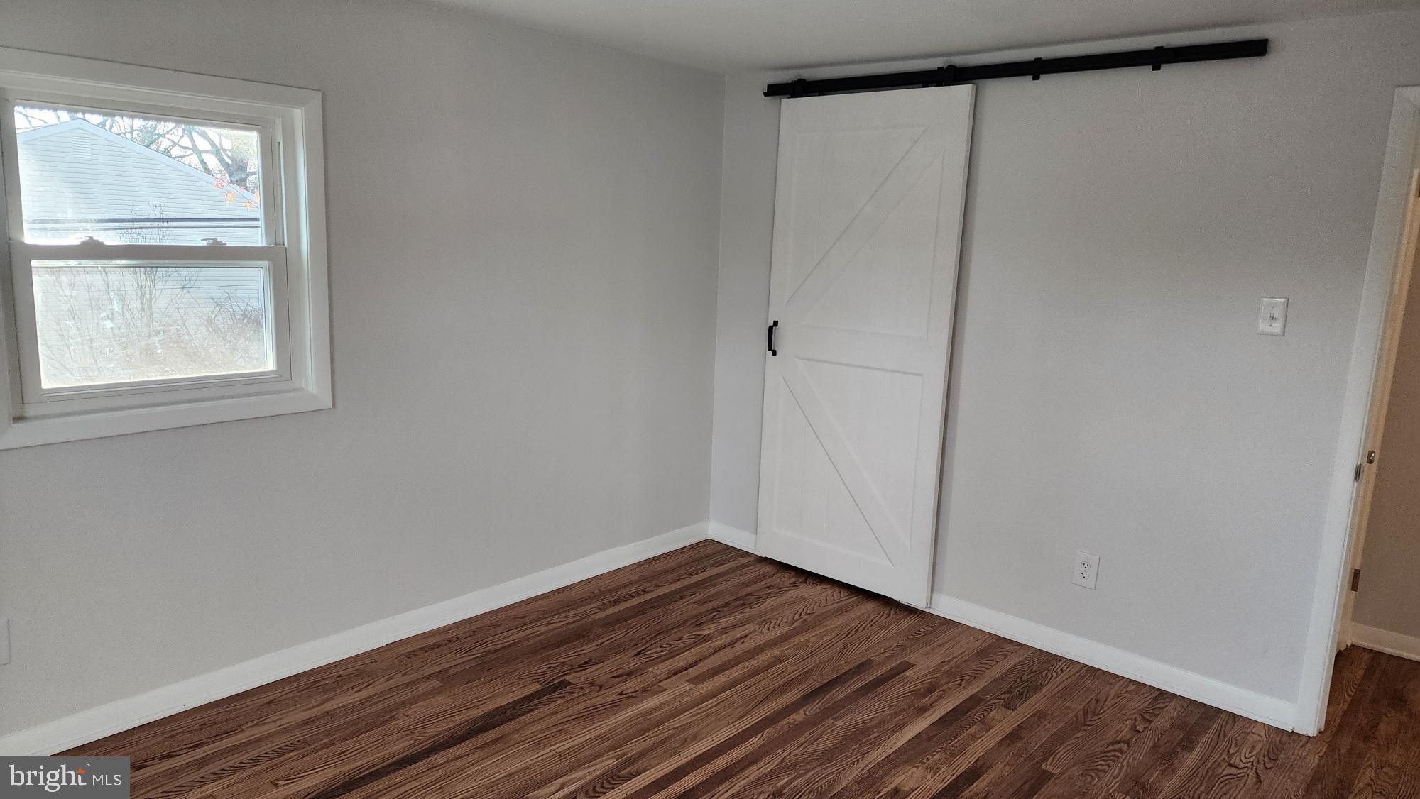 213 Upper Valley Road North Wales, PA 19454 - Photo 17 of 28 a view of an empty room with wooden floor and window