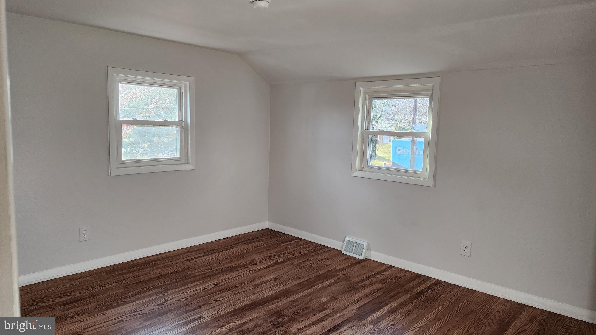 213 Upper Valley Road North Wales, PA 19454 - Photo 20 of 28 a view of an empty room with wooden floor and a window