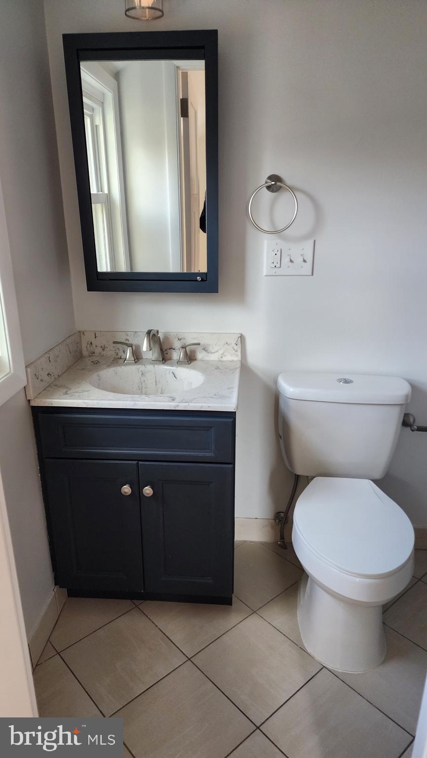 213 Upper Valley Road North Wales, PA 19454 - Photo 21 of 28 a bathroom with a toilet sink and mirror