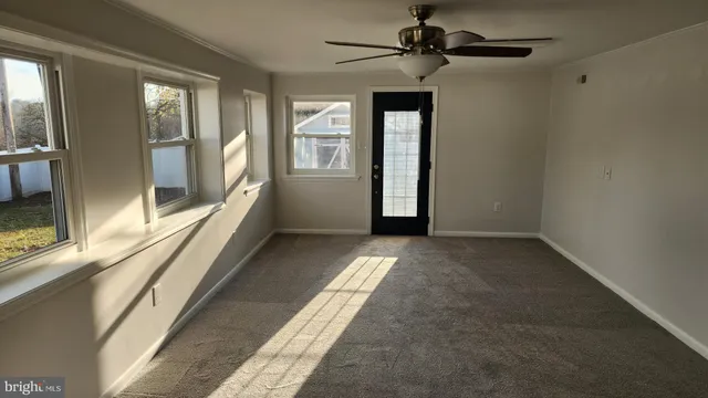 a view of a room with large windows