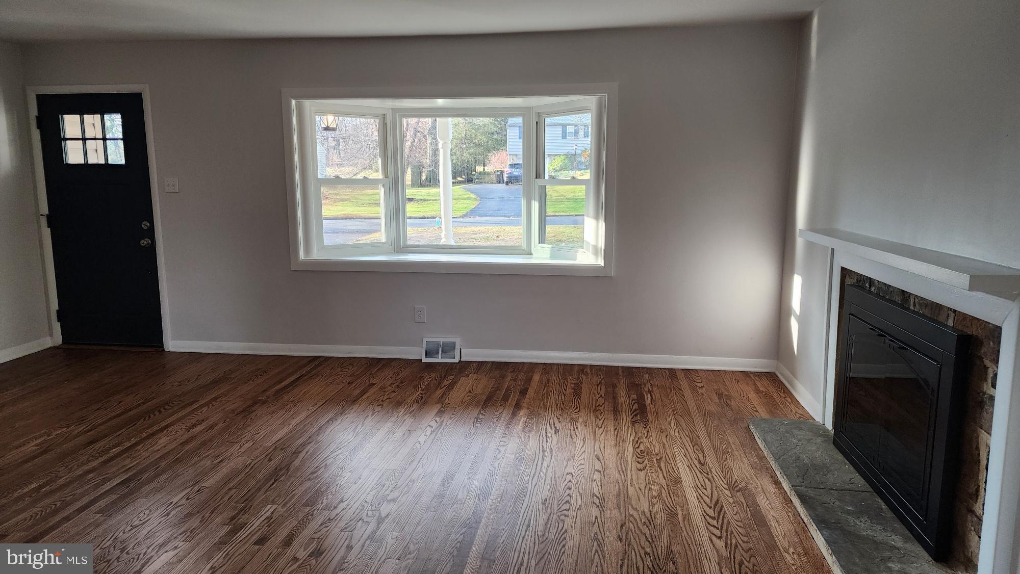 213 Upper Valley Road North Wales, PA 19454 - Photo 6 of 28 an empty room with wooden floor and windows