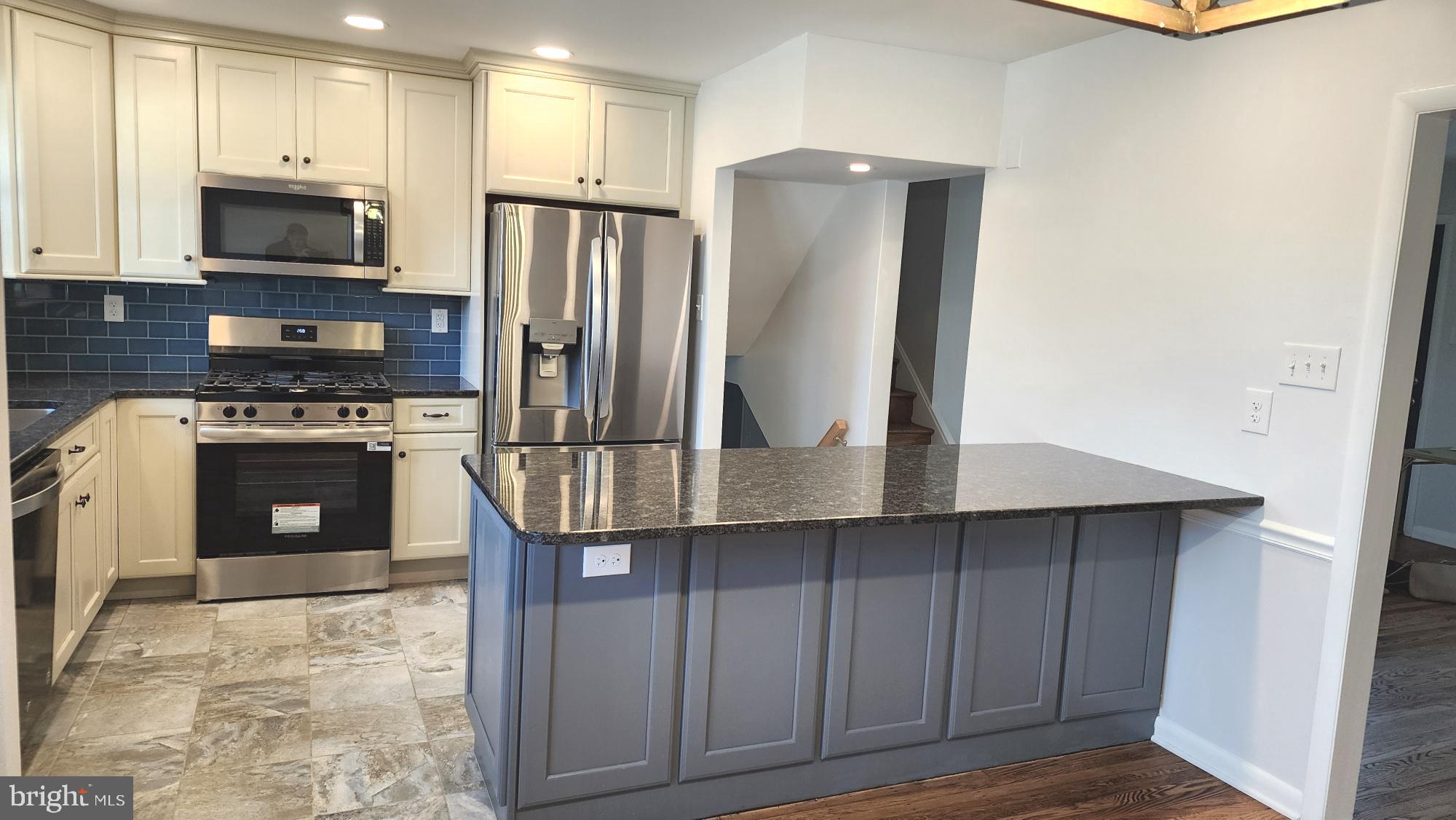 213 Upper Valley Road North Wales, PA 19454 - Photo 10 of 28 a kitchen with stainless steel appliances a stove a refrigerator and a microwave
