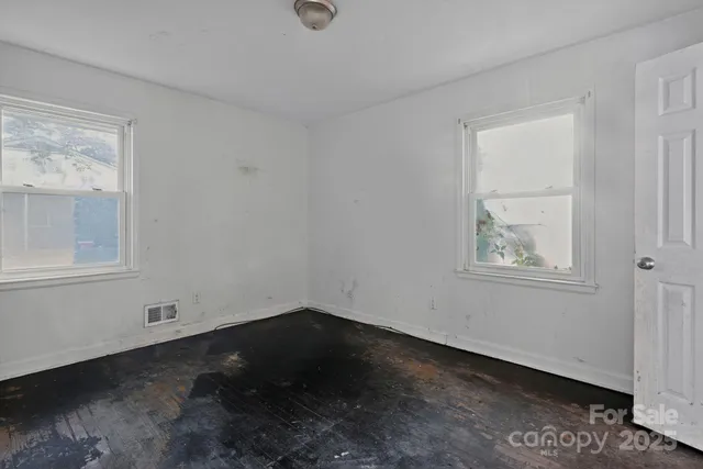 a view of room with window and hardwood floor