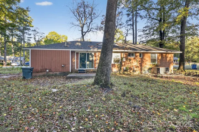 a view of a house with a yard and garden