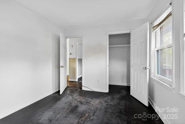 a view of empty room with windows